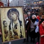 Protesters hold an Orthodox icon during a Belgrade rally held by the Serbian Orthodox Church in January to protest Montenegro's religion law.