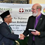 Nahdlatul Ulama leader Yahya Cholil Staquf presents World Evangelical Alliance leader Thomas Schirrmacher with a festschrift at The Nation's Mosque in Washington, DC, during the 2021 International Religious Freedom Summit.