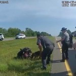 This image taken from police body cam video shows a police dog attacking Jadarrius Rose in Circleville, Ohio.
