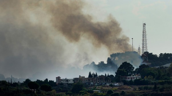 Smoke rises from an Israeli army position which was attacked by Hezbollah fighters near the Lebanese border with Israel.