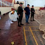 Police investigators and soldiers are seen at the site of an explosion at Mindanao State University in the Philippines.