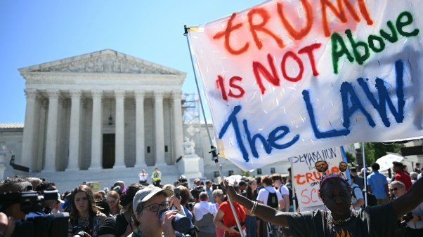 Protesters in front of the US Supreme Court after they ruled that presidents have presumptive immunity for official acts.