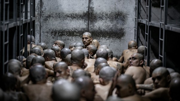 Inmates wait as 2,000 detainees are moved to the Terrorist Confinement Centre in El Salvador.