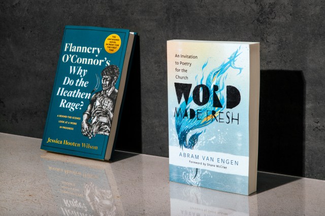 Photograph of "word made fresh" book and "why do the heathen rage" book leaning against a concrete wall