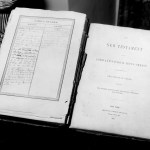 A vintage photo of a Bible with a genealogy on the front page.