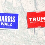 Campaign signs for Harris and Trump laying on a map.