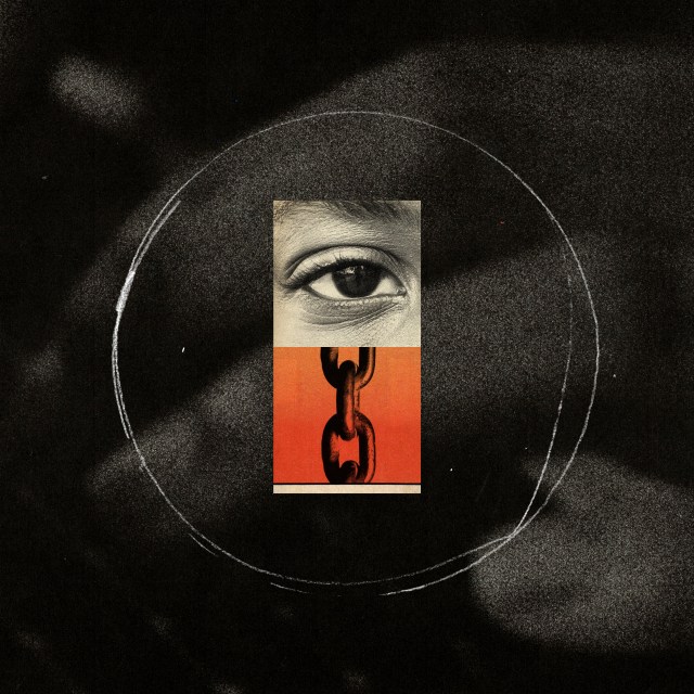 An eye and chains over a hand typing