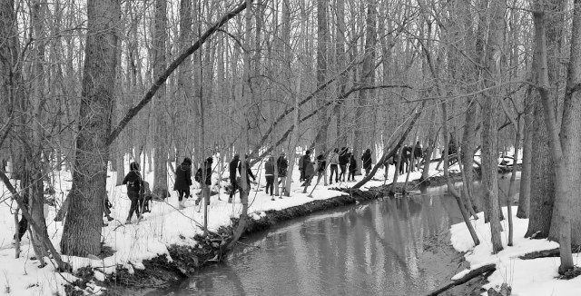 College students collect data for a biology class at Plaster Creek.
