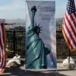 A man furls a flag after a US naturalization ceremony in Los Angeles for immigrants becoming citizens.