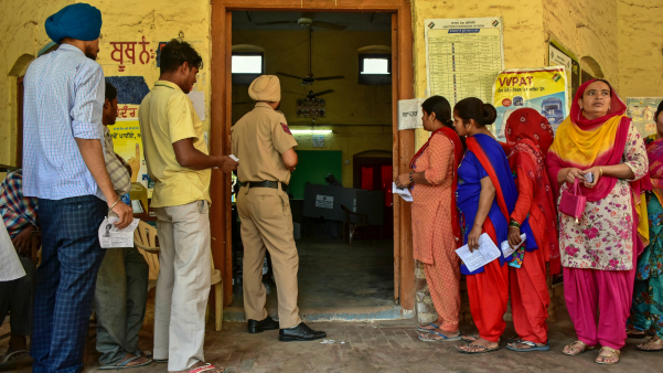 Voters line up to cast their ballots in the Punjab state elections.